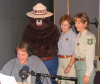 Photo of Jeff Foxworthy, Smokey, and USFS personnel