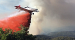 Photo of a single engine air tanker making a retardant drop.