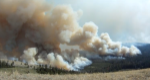 Image of fire burning with large cloud of smoke.  