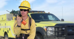 Firefighter talking on a radio. 